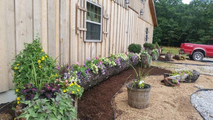 All through our grounds you can find touches of beauty like our stunning floral displays and landscaping near the barn. 